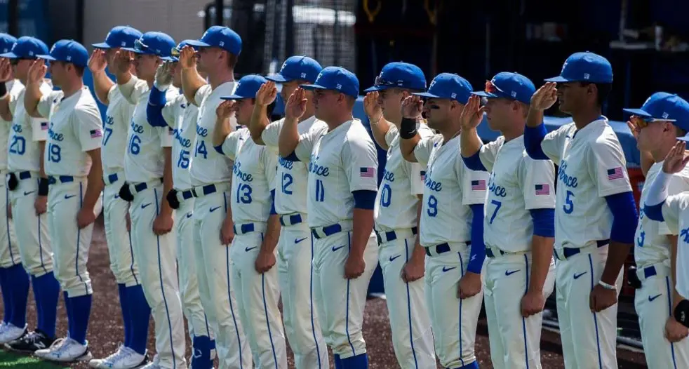 Baseball players saluting