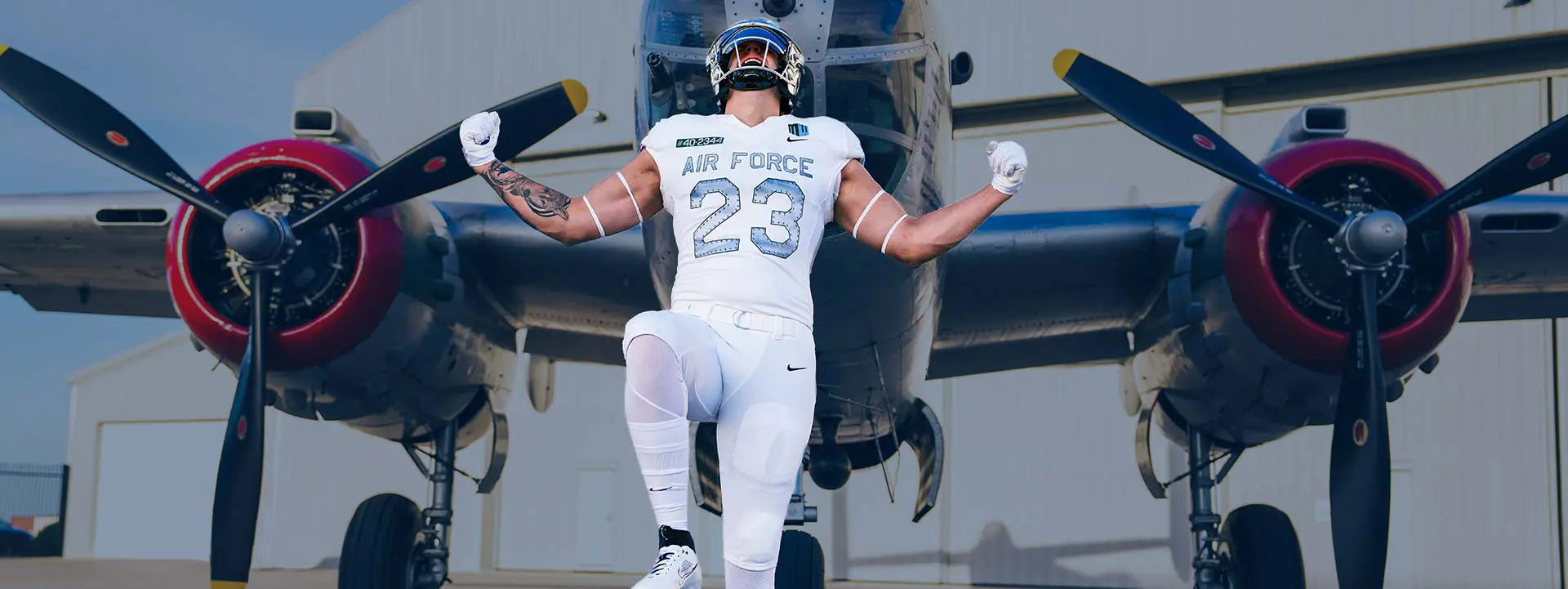 Football player in front of helicopter